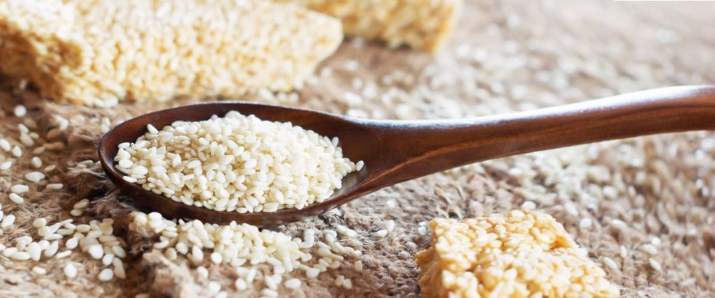 White sesame seeds on spoon